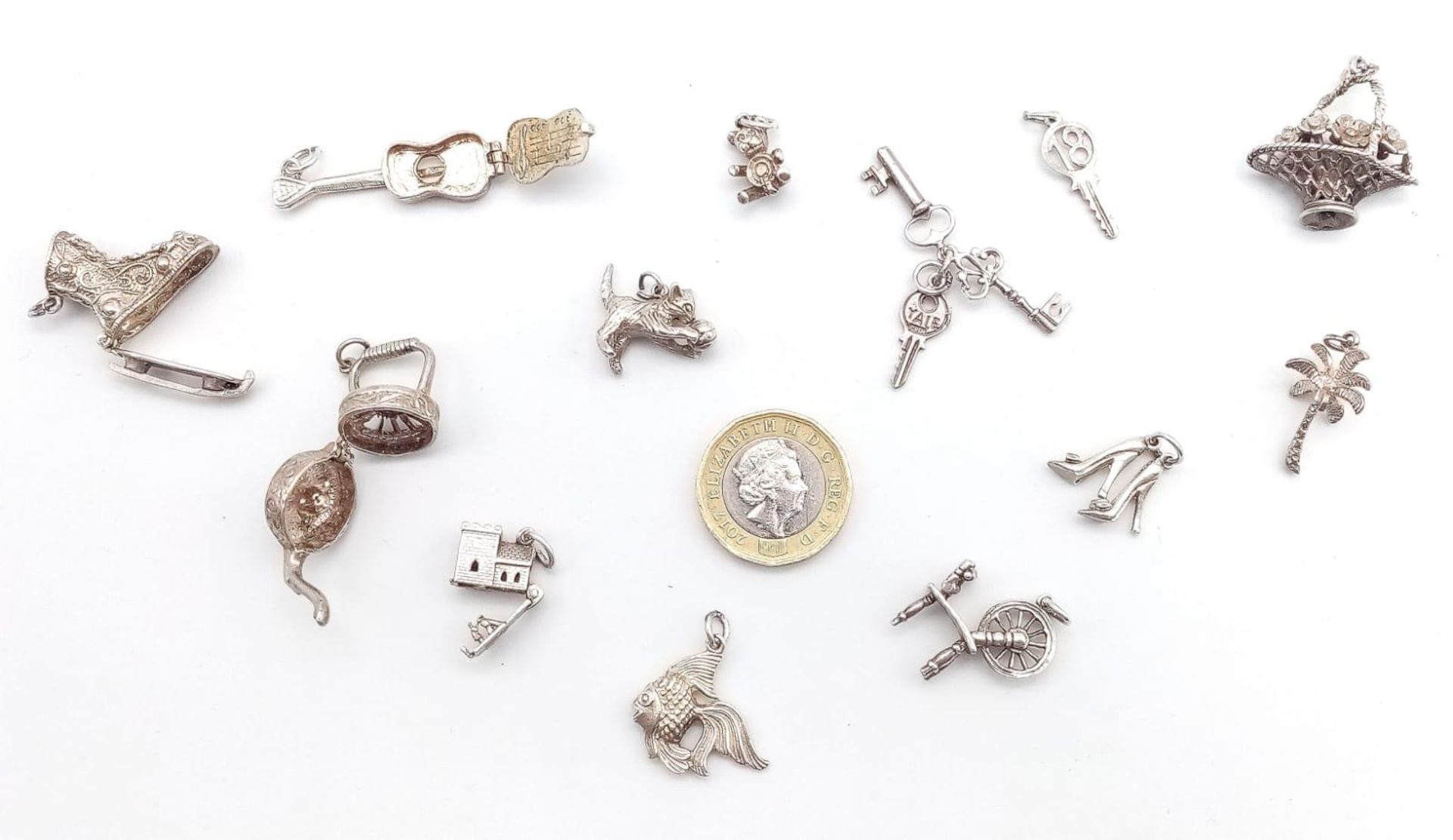 A collection of vintage silver charms/pendants such as a cat, castle, etc. Total weight 43.4G. - Image 3 of 3