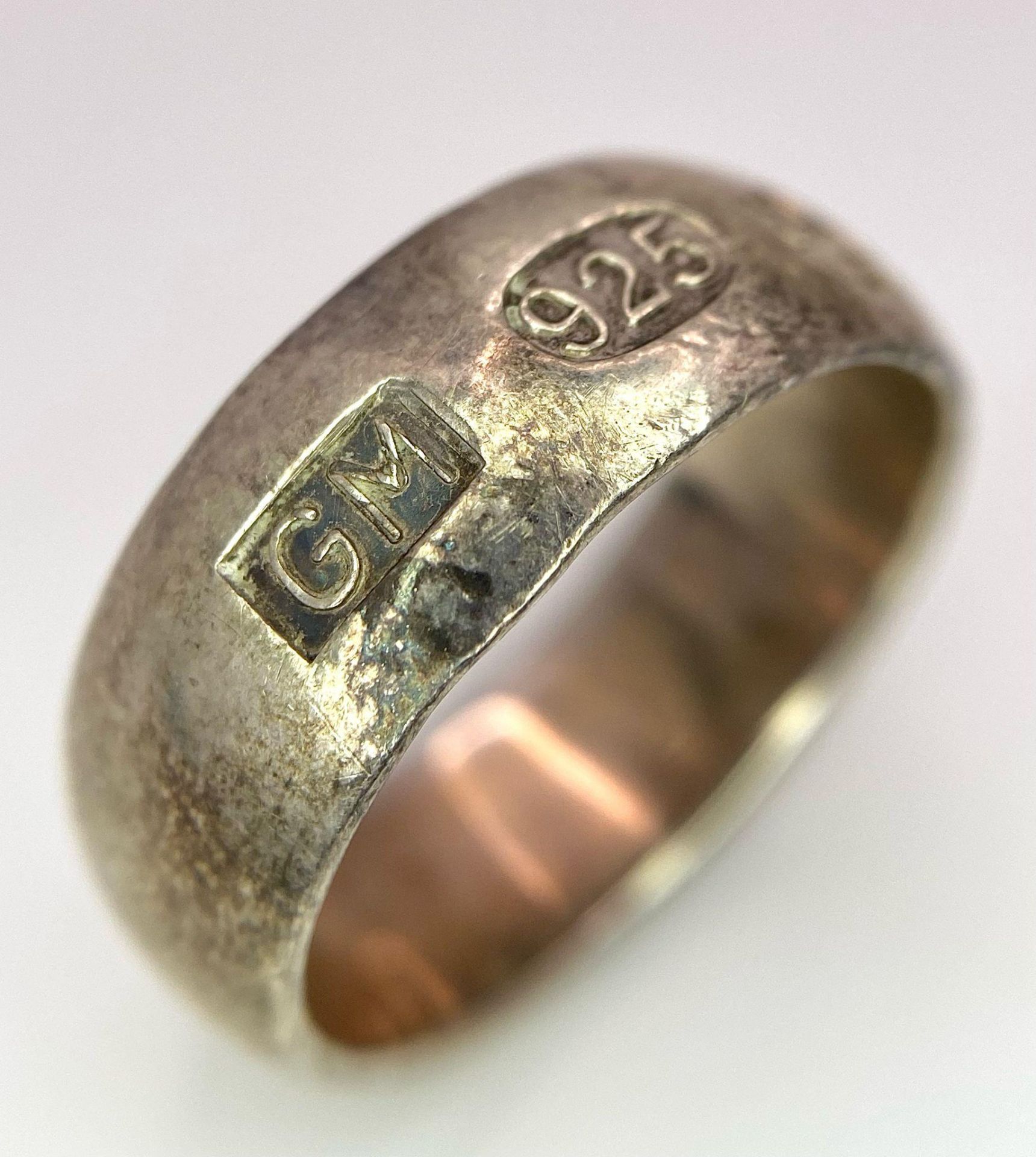 A vintage sterling silver band ring with full Sheffield Millennium hallmarks. Total weight 8.88G.