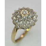 A 9K GOLD DIAMOND CLUSTER RING . 3gms size N