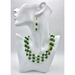 A stunning, three row necklace of alternating green jade and natural white pearls from South Pacific