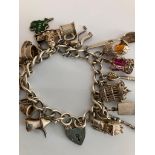 Vintage SILVER CHARM BRACELET Full of interesting Silver Charms to include Caravan, Egg with