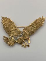 A Fabulous 9 carat GOLD EAGLE BROOCH set with DIAMONDS & RUBY. Having Diamonds Mounted to Mid