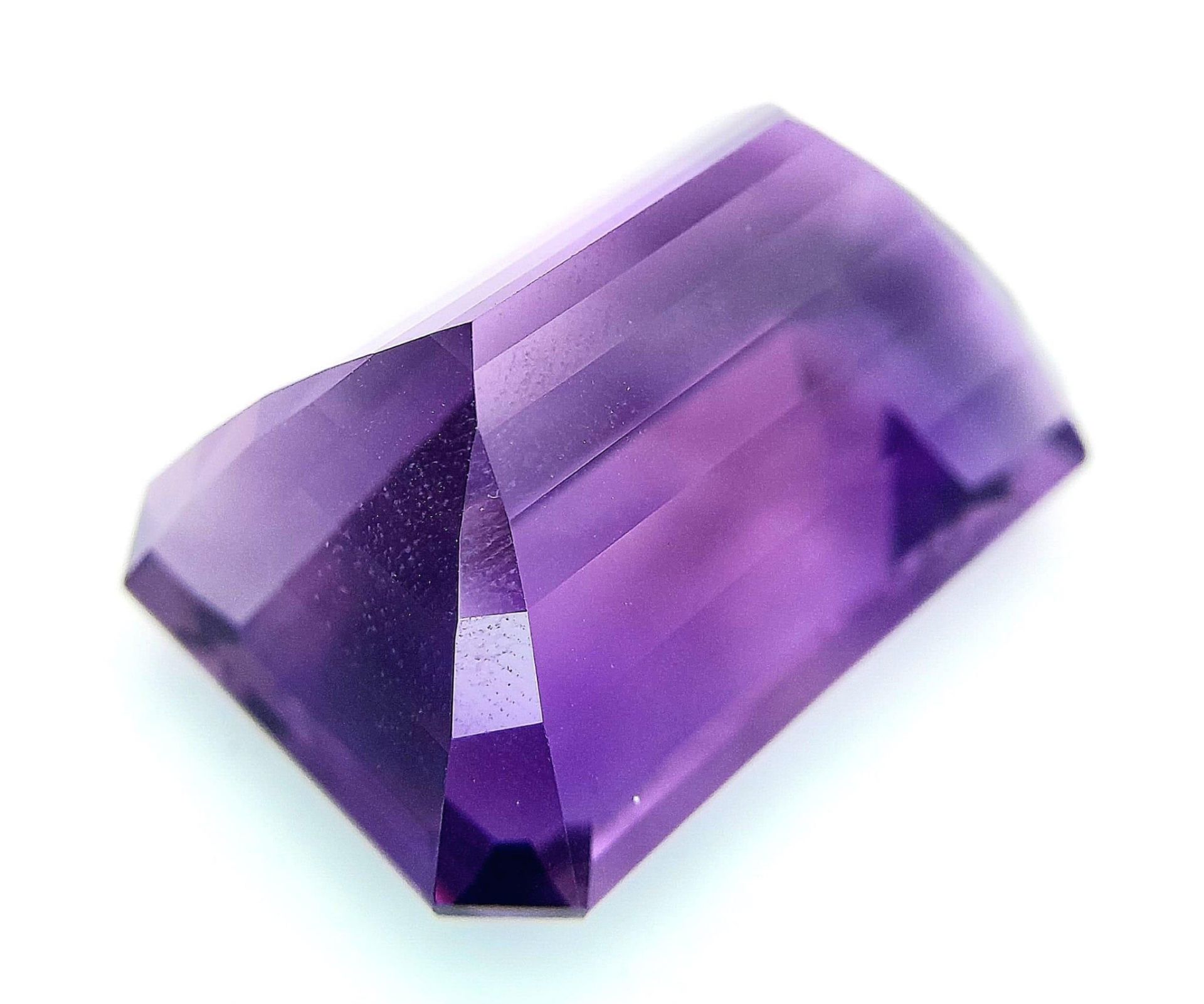 A large (92.03 carats), octagonal step cut AMETHYST, with excellent vivid and uniform colouration - Image 2 of 8