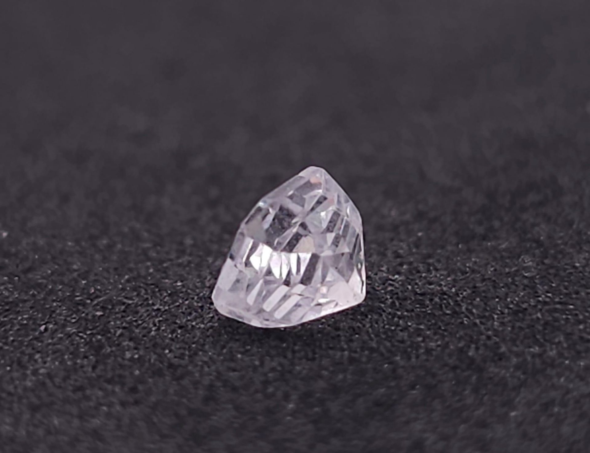 A 0.76ct Madagascar Colourless Natural Sapphire, in the Octagon Cut. Comes with the AIG Certificate. - Image 4 of 6