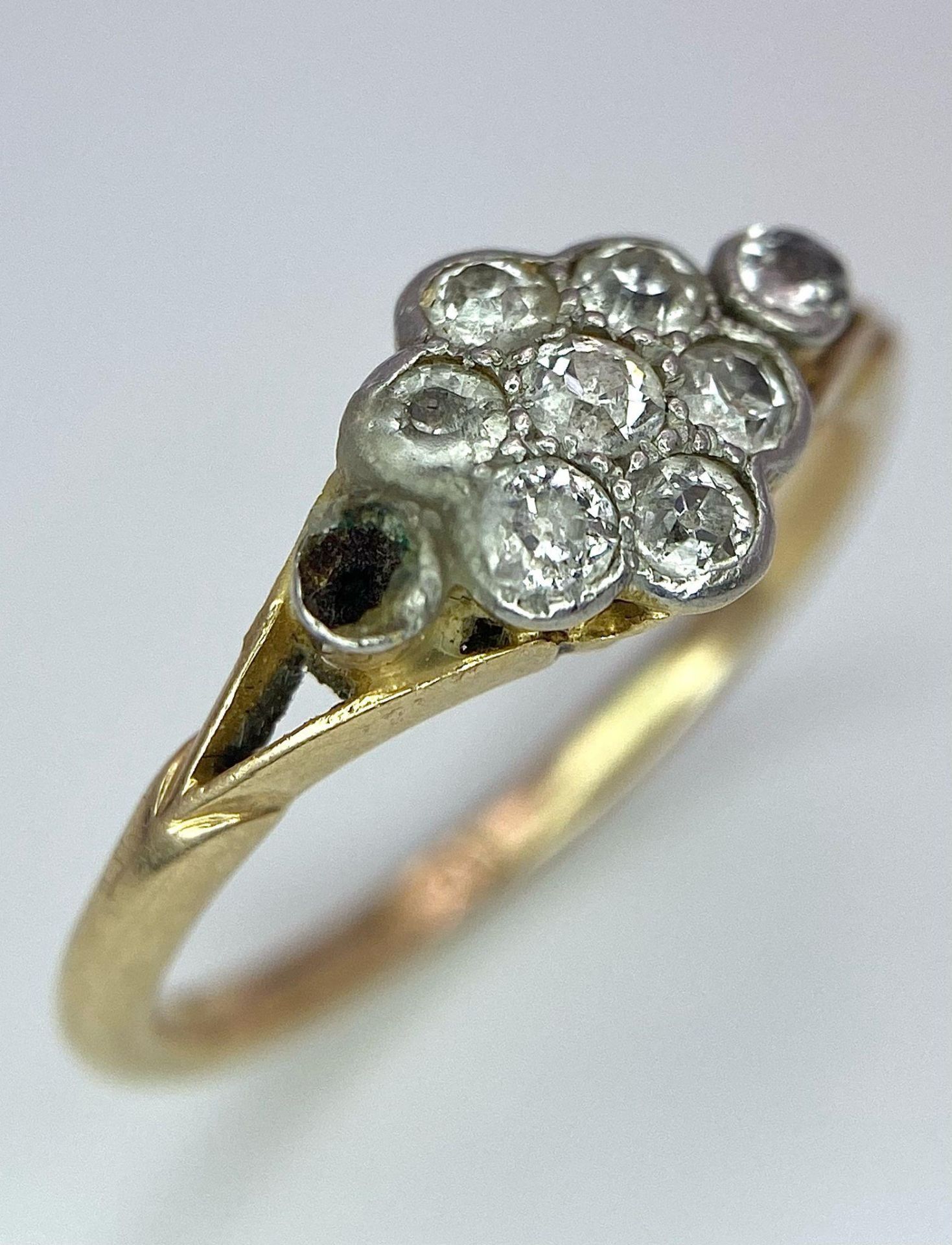 A VINTAGE 18K GOLD DIAMOND CLUSTER RING (ONE STONE MISSING REFLECTED IN PRICE) . 2.4gms size J