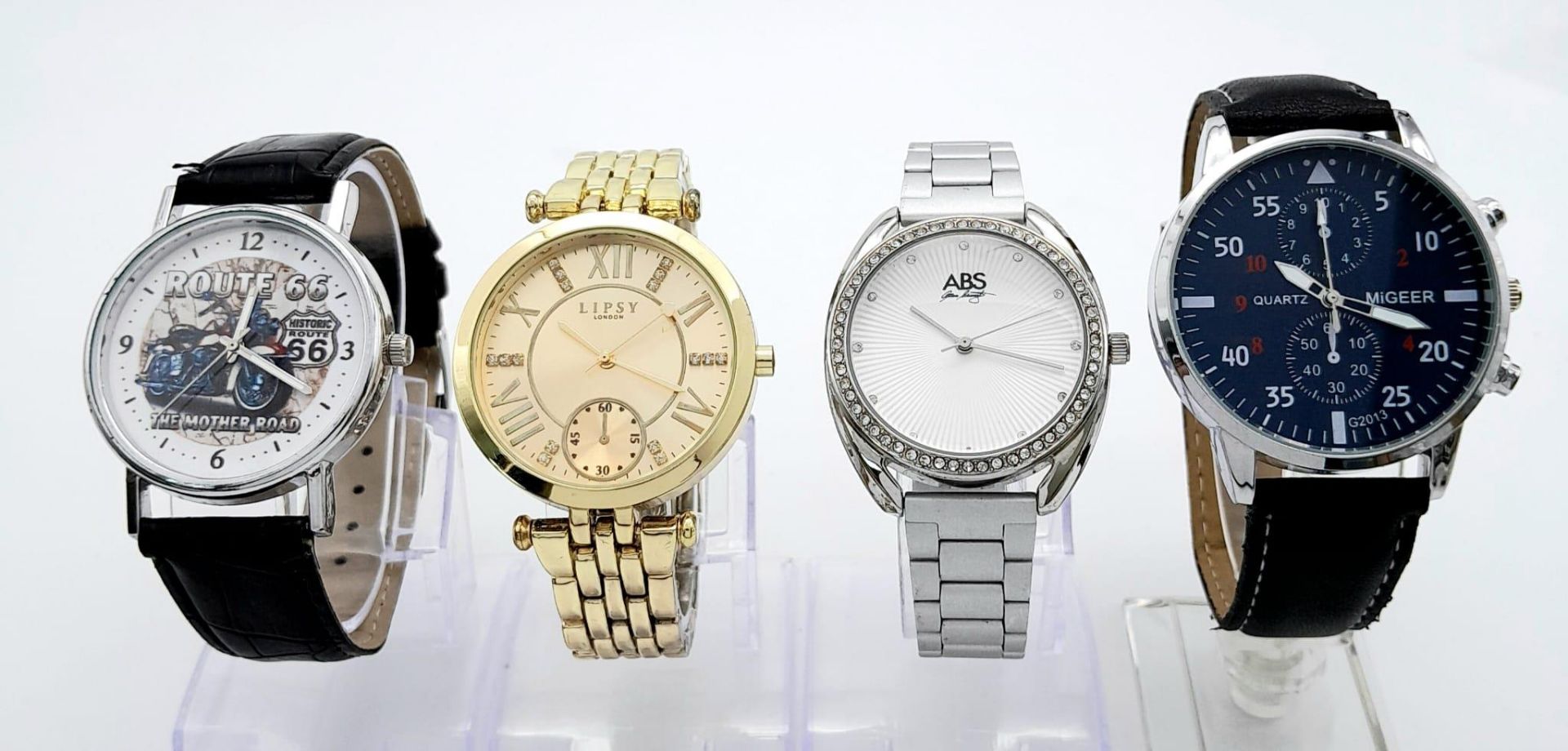 A Parcel of Four Quartz Fashion Watches, Two Men & Two Ladies Comprising; 1) A Gold Tone Clear Stone