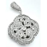 A 9K WHITE GOLD DIAMOND SET LOCKET. 0.50CT. 6G. 3.5CM