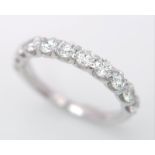 An 18 K white gold half eternity ring with good quality brilliant cut diamonds. Size: O, weight: 2.9