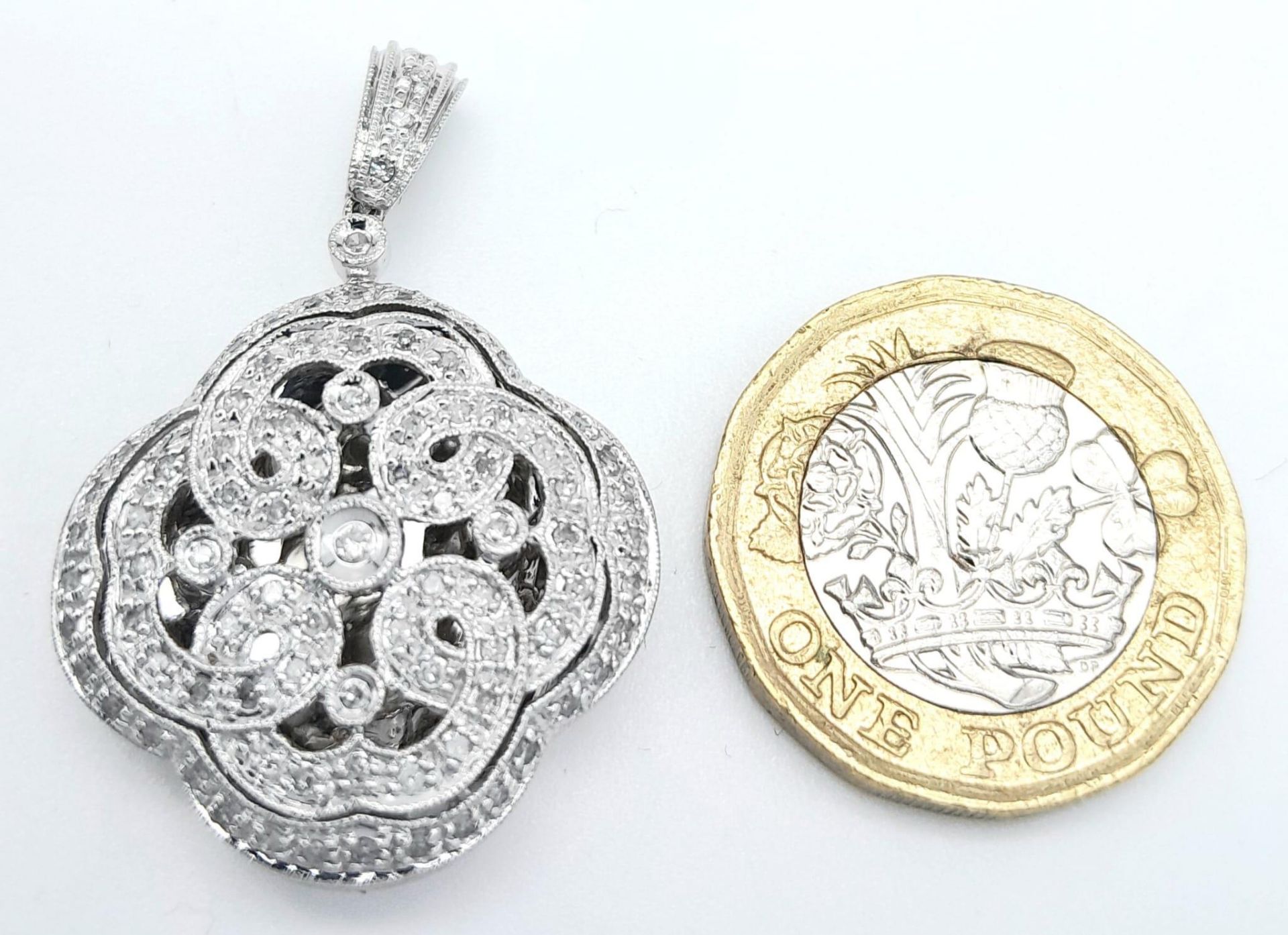 A 9K WHITE GOLD DIAMOND SET LOCKET. 0.50CT. 6G. 3.5CM - Bild 6 aus 9