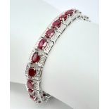 An Exquisite Hallmarked 2018 Sterling Silver 28 Oval Cut Ruby Set Bracelet. Each Ruby Measures 5mm