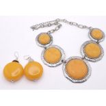 An Egg Yolk Amber Resin Necklace and Earrings Set. 46cm necklace. earrings - 5cm.