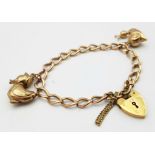 A vintage 9 K rose gold chain bracelet with a padlock clasp and two chams (a snail and a duck). Good