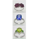 Three 925 Sterling Silver Gemstone Rings: Topaz - Size S, Peridot - Size P and Ruby - Size P.