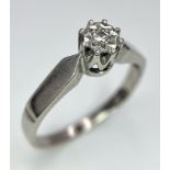 An 18K White Gold Diamond Solitaire Ring. Size M. 2.61g