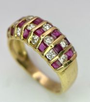 A STUNNING 18K GOLD DIAMOND AND RUBY RING , HAVING 4 ROWS OF ALTERNATING STONES . 4.1gms size M