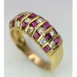 A STUNNING 18K GOLD DIAMOND AND RUBY RING , HAVING 4 ROWS OF ALTERNATING STONES . 4.1gms size M