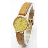 A Garrard 9K Gold Cased Quartz Ladies Watch. New brown leather strap. 9k gold case - 22mm. Gold tone