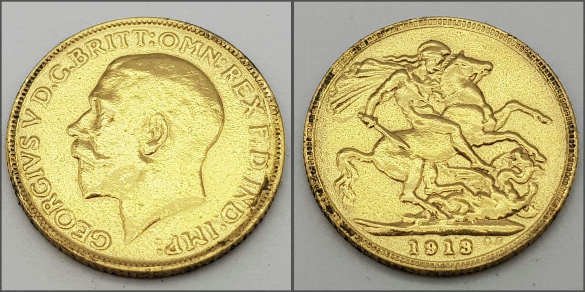 A 22K GOLD SOVEREIGN DATED 1913 .