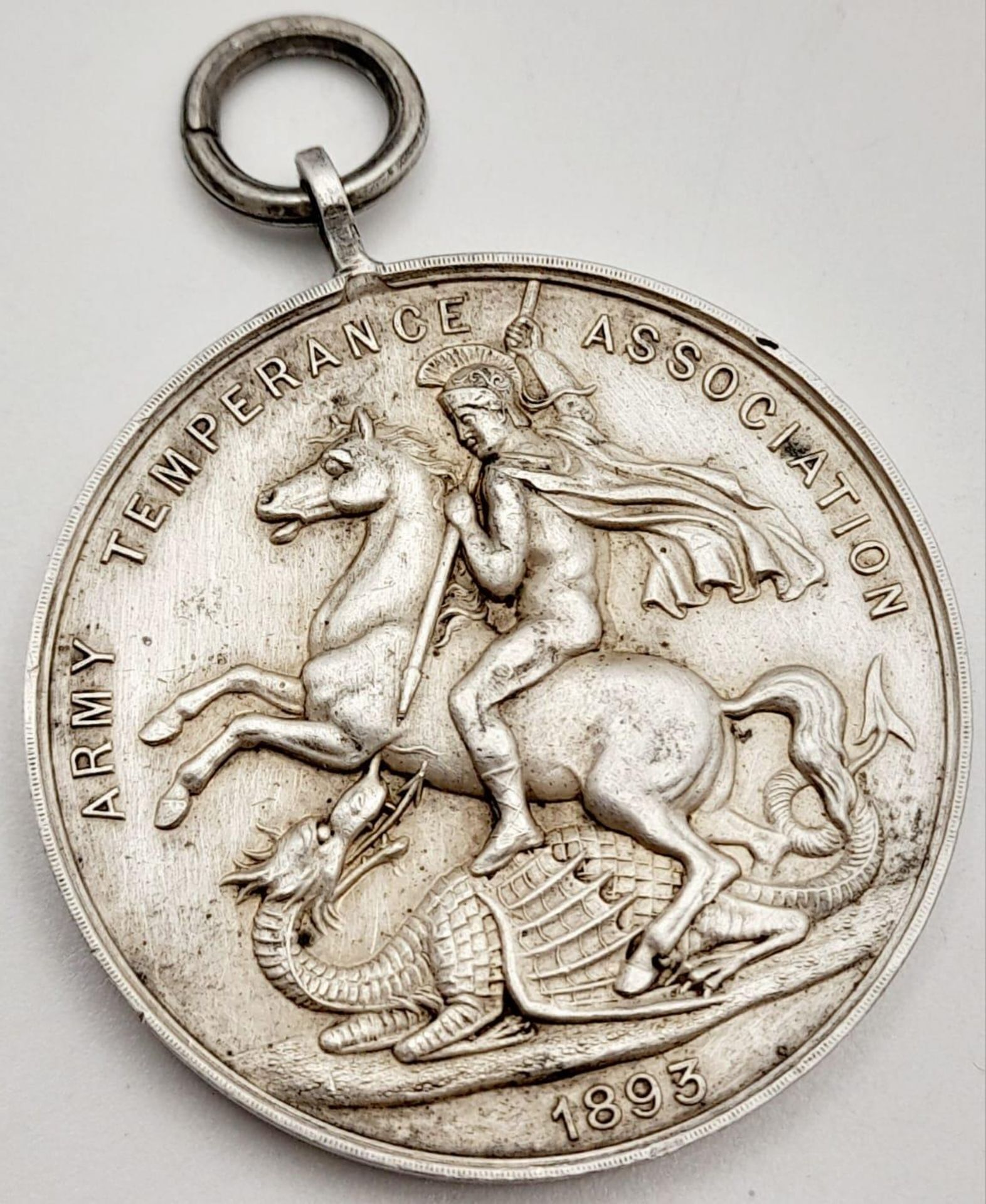 A Silver 1893 Dated Army Temperance Medal Issued by Badderley Bros. London. These medal were