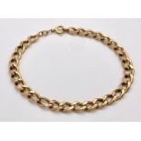 An 18K Yellow Gold Flat Curb Link Bracelet. 19cm. 4.25g weight.