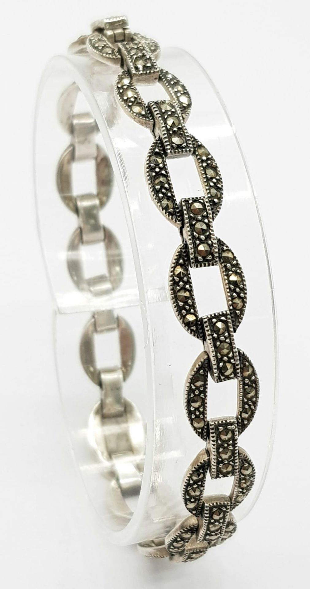 A 925 silver Marcasite link bracelet. Total weight 14.4G. Total length 19cm.