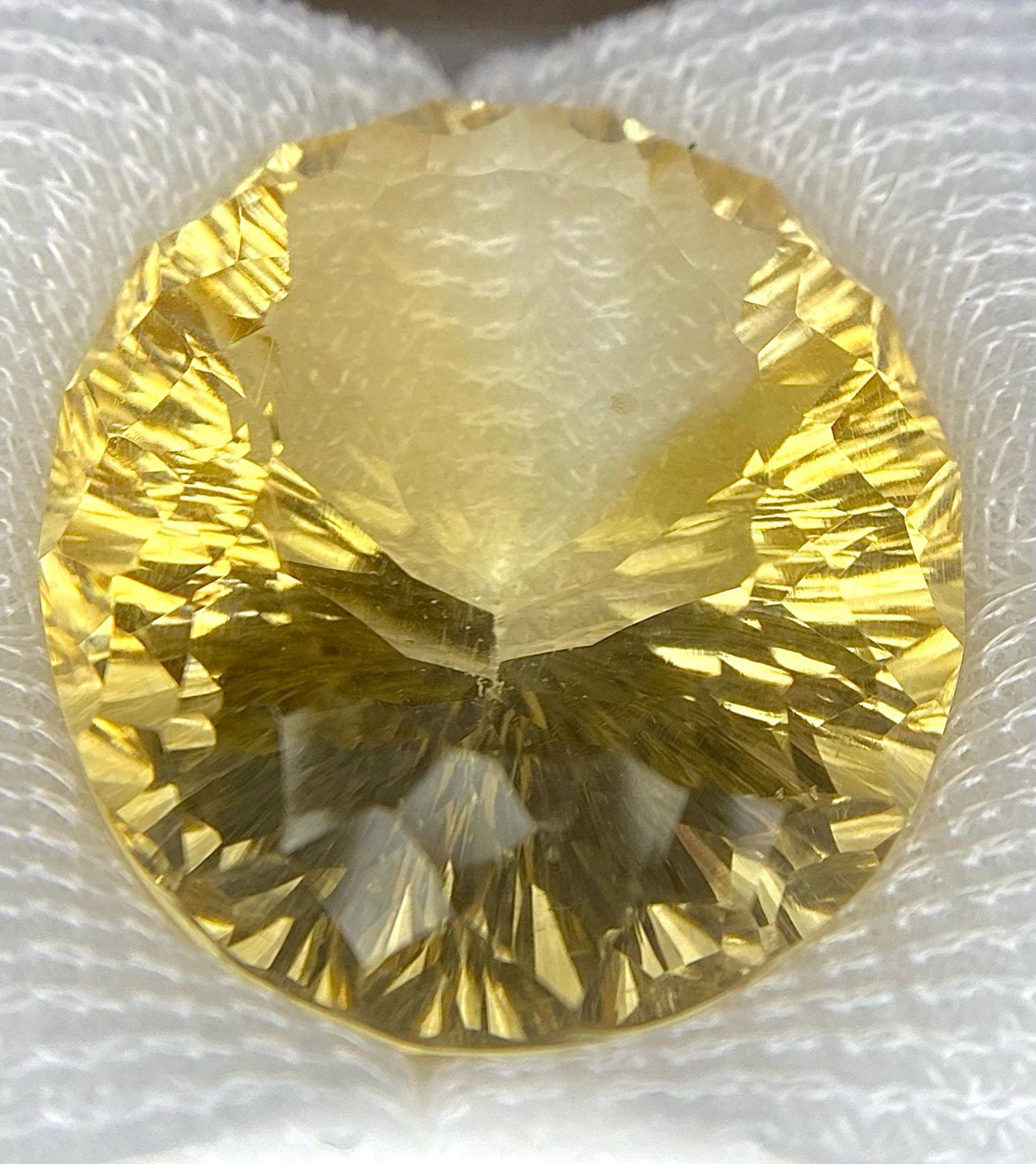 A Sealed 51.75ct Madagascar Natural Citrine Gemstone - Oval cut. Comes with the AIG Certificate.