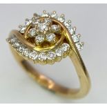 An attractive 14K Yellow Gold (tested as) Diamond Swirl Ring, 0.55ct diamond weight, 4.6g total