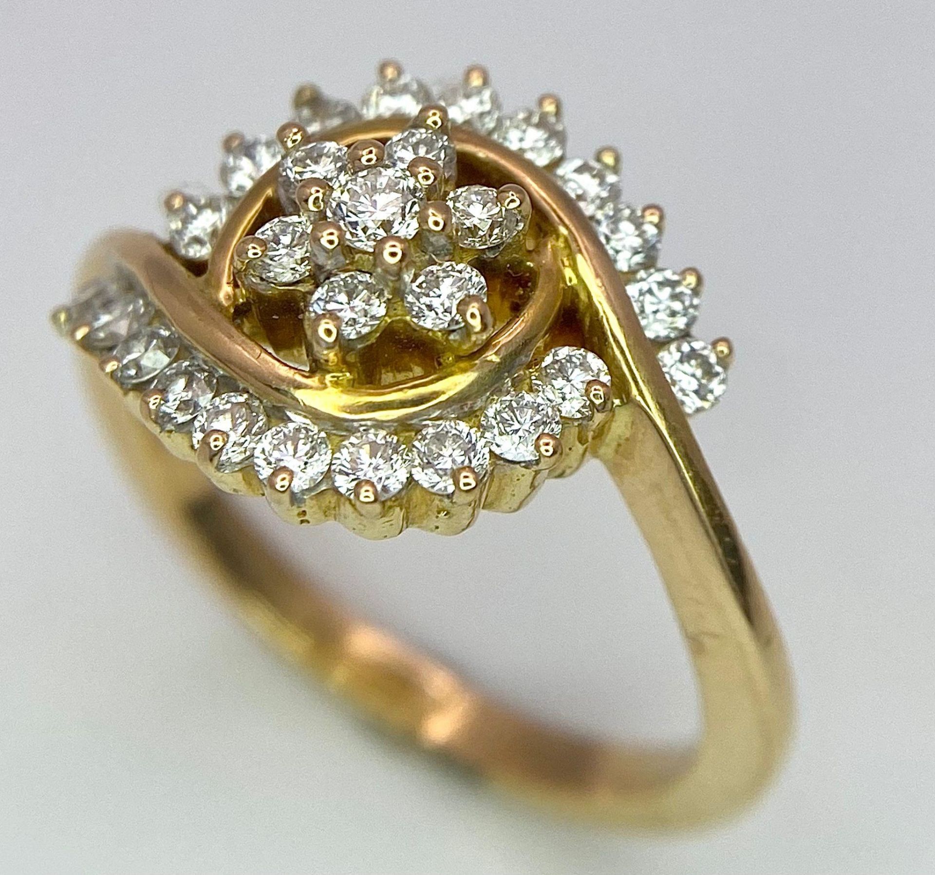An attractive 14K Yellow Gold (tested as) Diamond Swirl Ring, 0.55ct diamond weight, 4.6g total