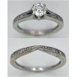 Two Different Style 18K White Gold Rings. A 0.50ct brilliant cut central diamond with diamond