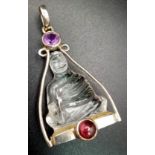 A Silver Mounted Carved Crystal, Ruby and Amethyst Buddha/Deity Pendant, 4.5cm Length. Gross