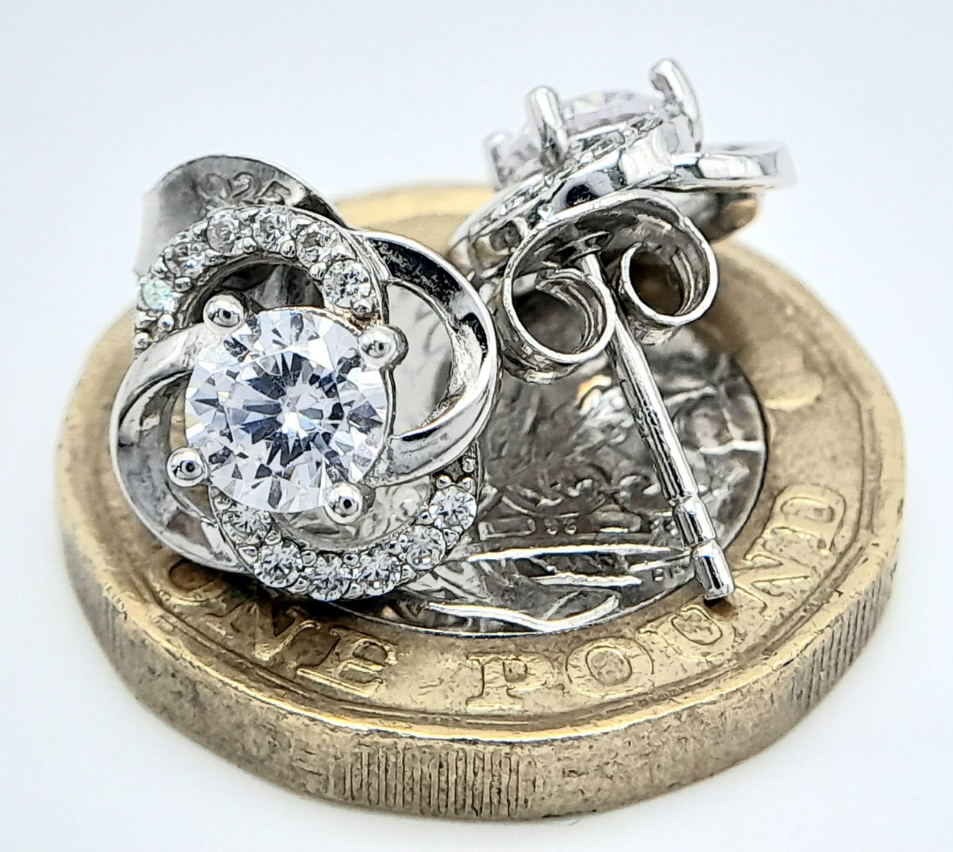 A fancy pair of 925 silver CZ earrings. Total weight 2.25G. - Image 7 of 9