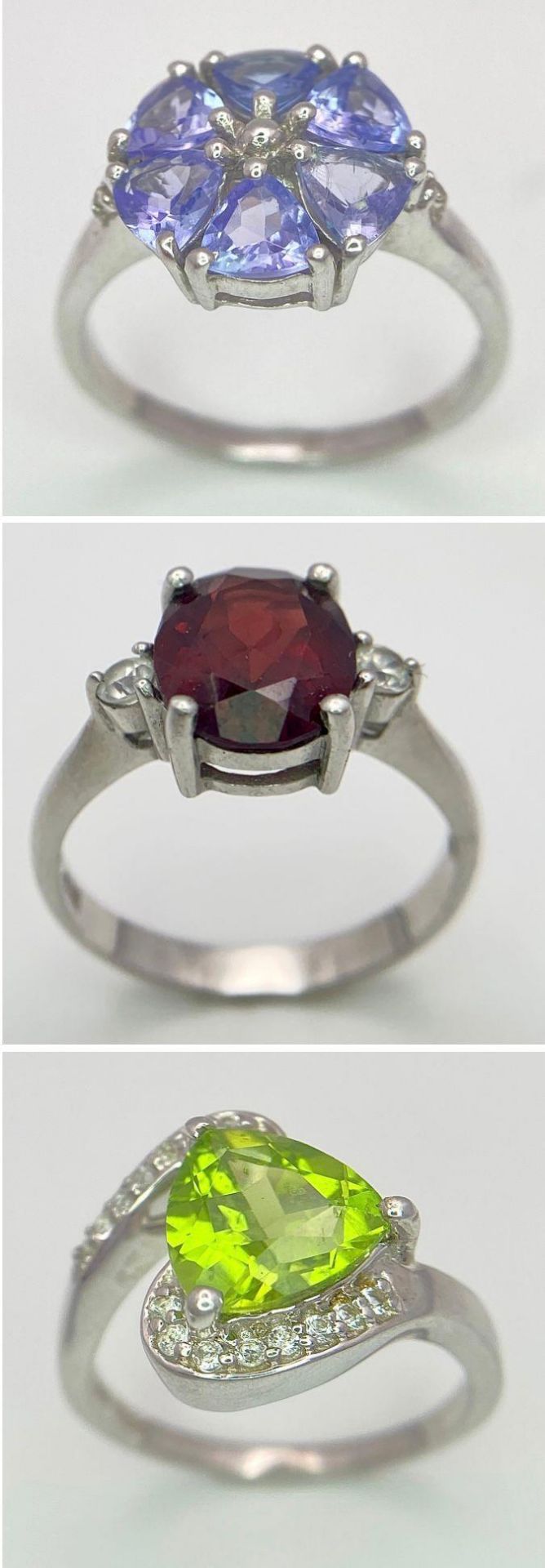 Three 925 Sterling Silver Gemstone Rings: Amethyst - Size O, Peridot - Size N and Garnet- Size O.