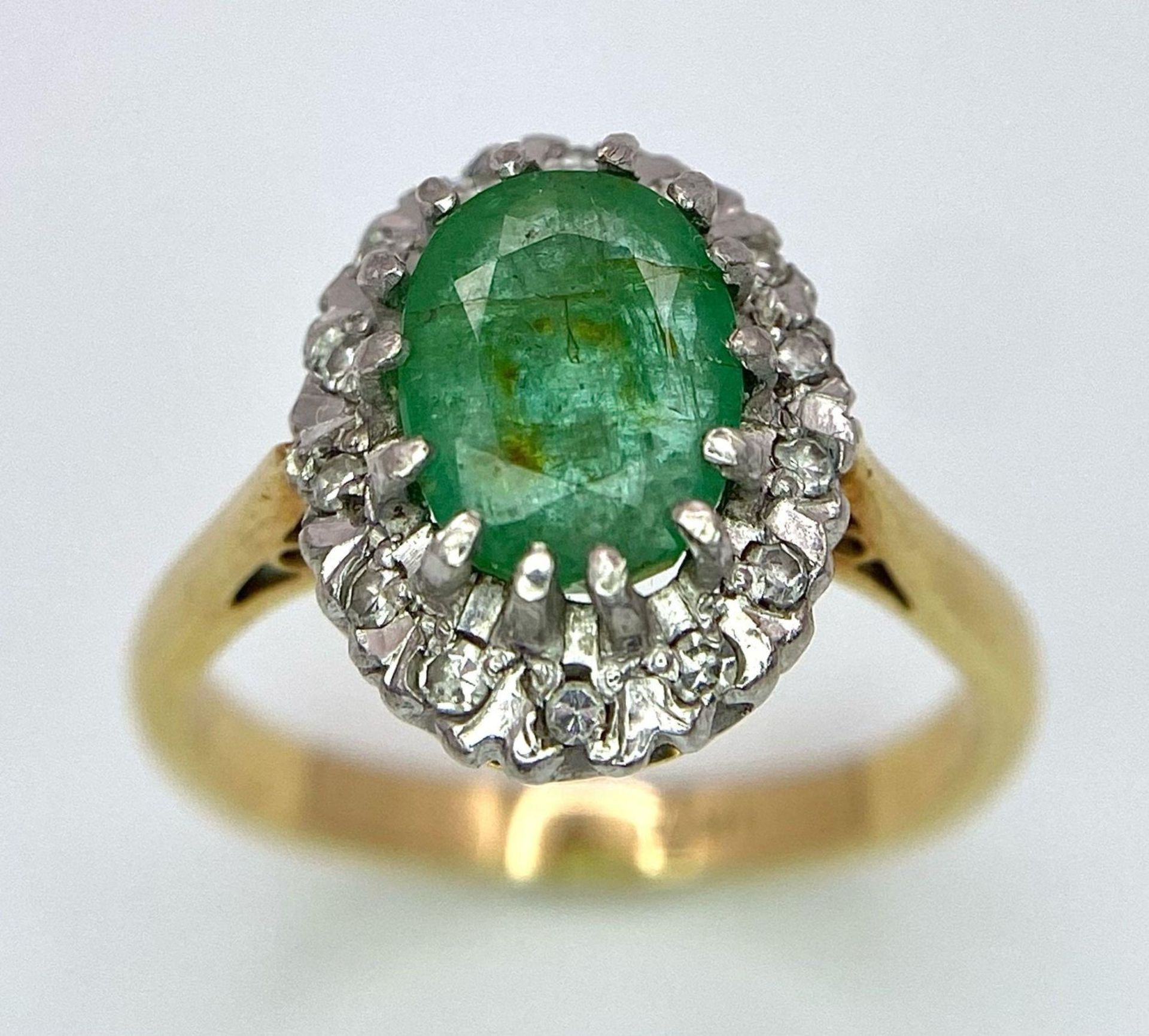 An 18K Yellow Gold, Emerald and Diamond Ring. Central 2ct emerald with a diamond surround. Size J. - Image 2 of 7