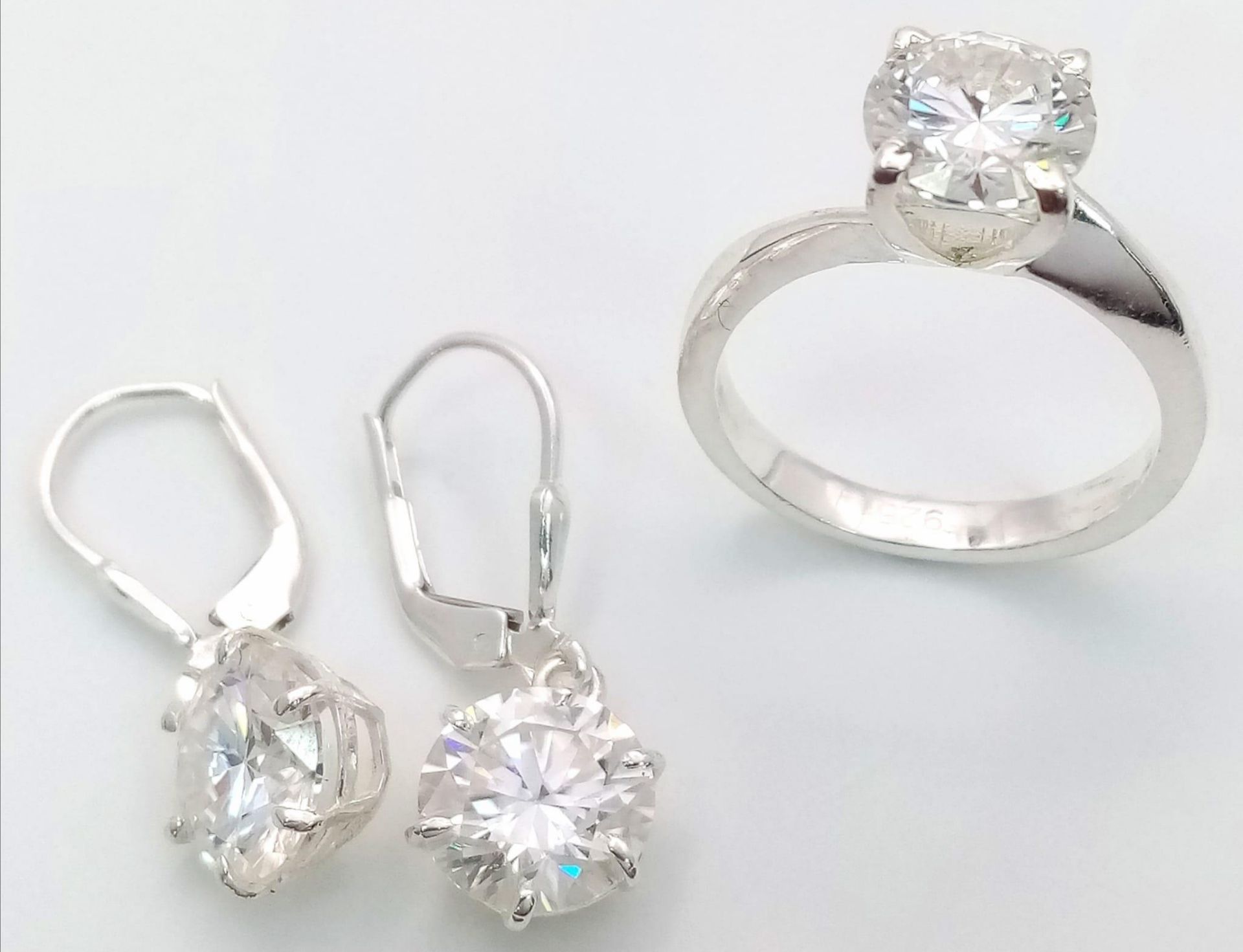 A White Moissanite Ring with a Matching Pair of Moissanite Earrings. 7ctw of moissanite. Ring size