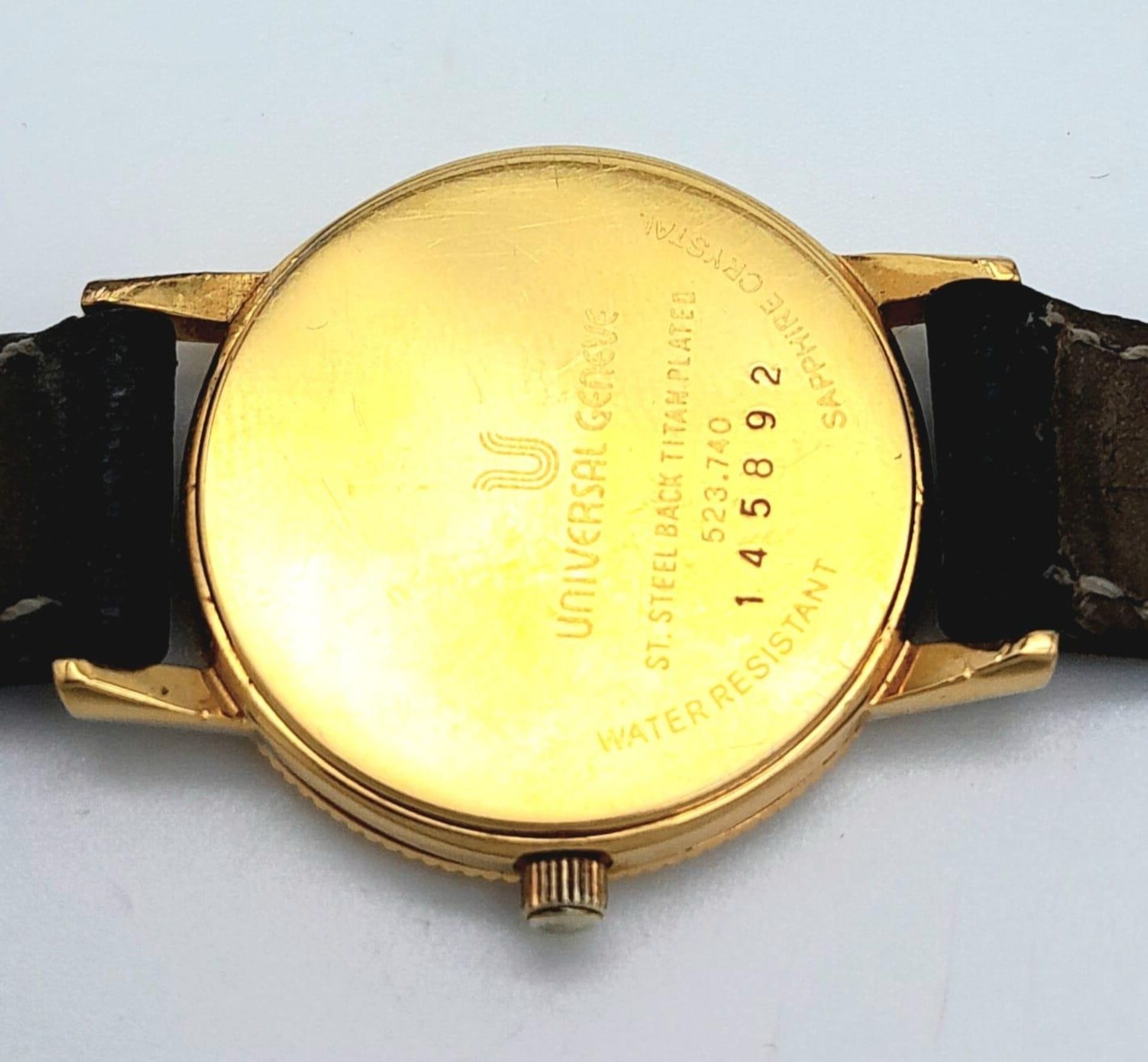 A Gold Plated Universal Quartz Ladies Watch. Black leather strap. Gold plated case - 23mm. White - Image 8 of 12