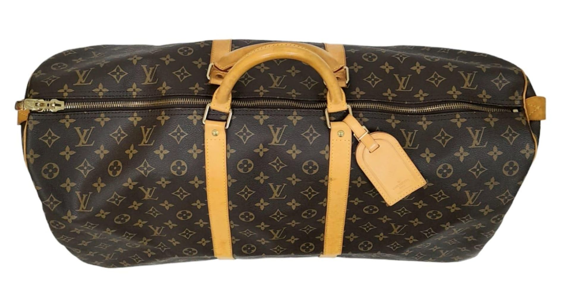 A Louis Vuitton Monogram Keepall 60 Travel Bag. Leather exterior with gold-toned hardware, two - Image 2 of 12