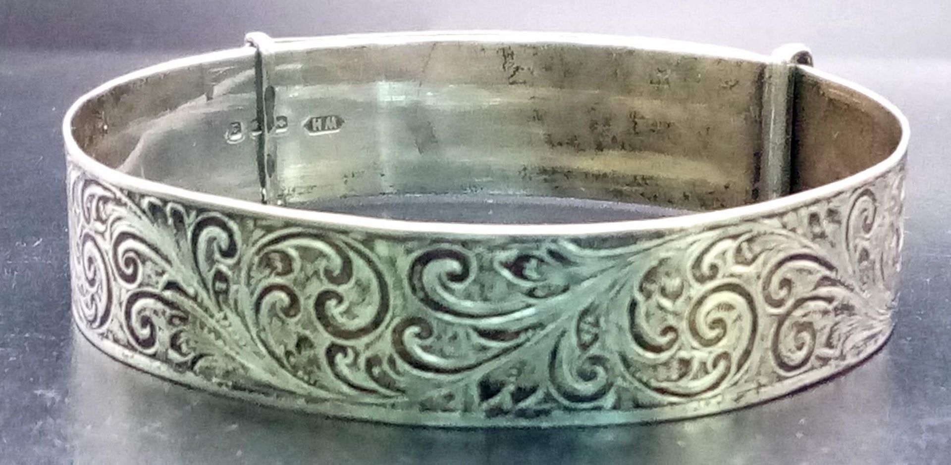 A vintage sterling silver adjustable bangle with fabulous engravings. Come with full London