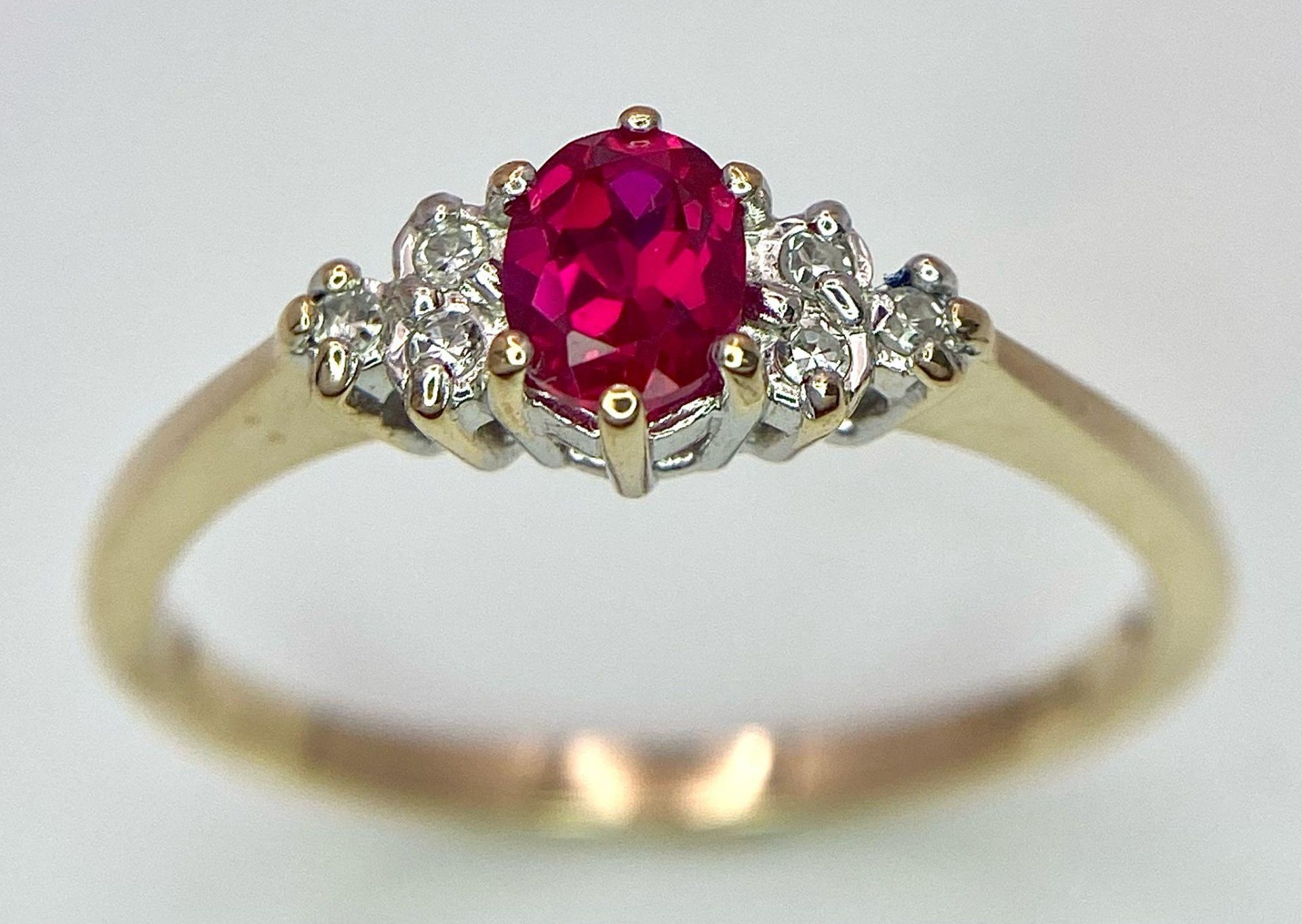 A 9K Yellow Gold Diamond & Red Stone (probably ruby) Ring. Size S, 2g total weight. Ref: 8418 - Image 2 of 7