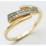 An 18K Yellow Gold Diamond 2 Row Crossover Ring. Size N, 2.2g total weight. Ref: 8461