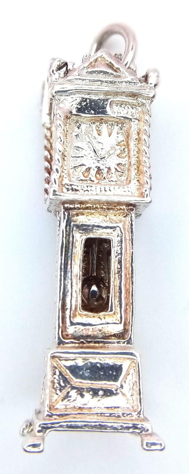 A Sterling Silver Grandfather Clock Charm, which Opens to Reveal the Movement. 3.2cm length, 4.5g