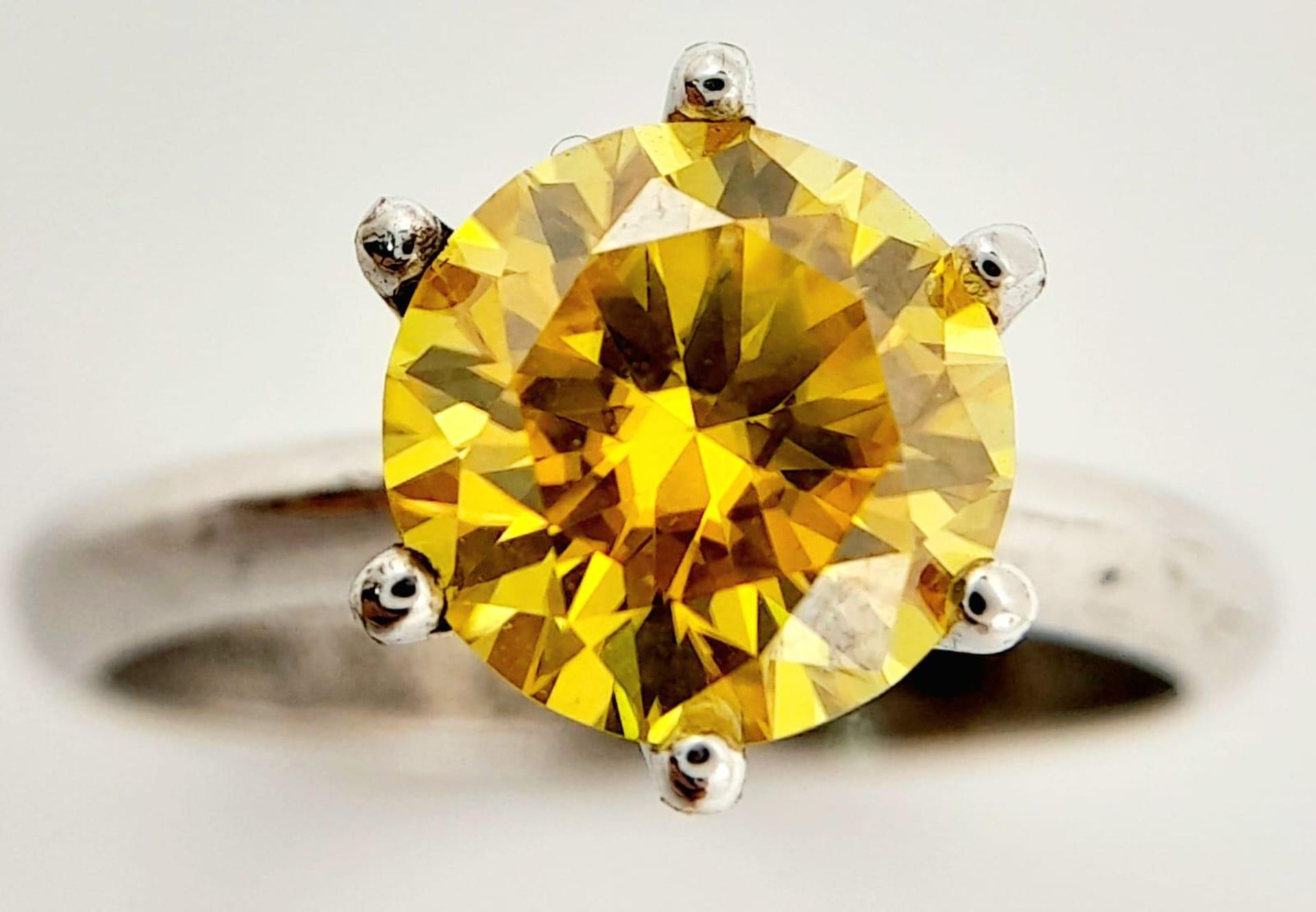 A sterling silver solitaire ring with a round cut yellow moissanite (2 carats), size: N1/2,