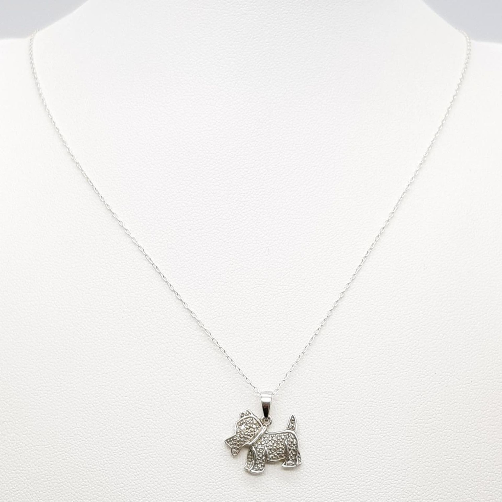 A fancy 925 silver stone set dog pendant on silver chain. Total weight 2.2G. Total length 46cm. - Image 2 of 5