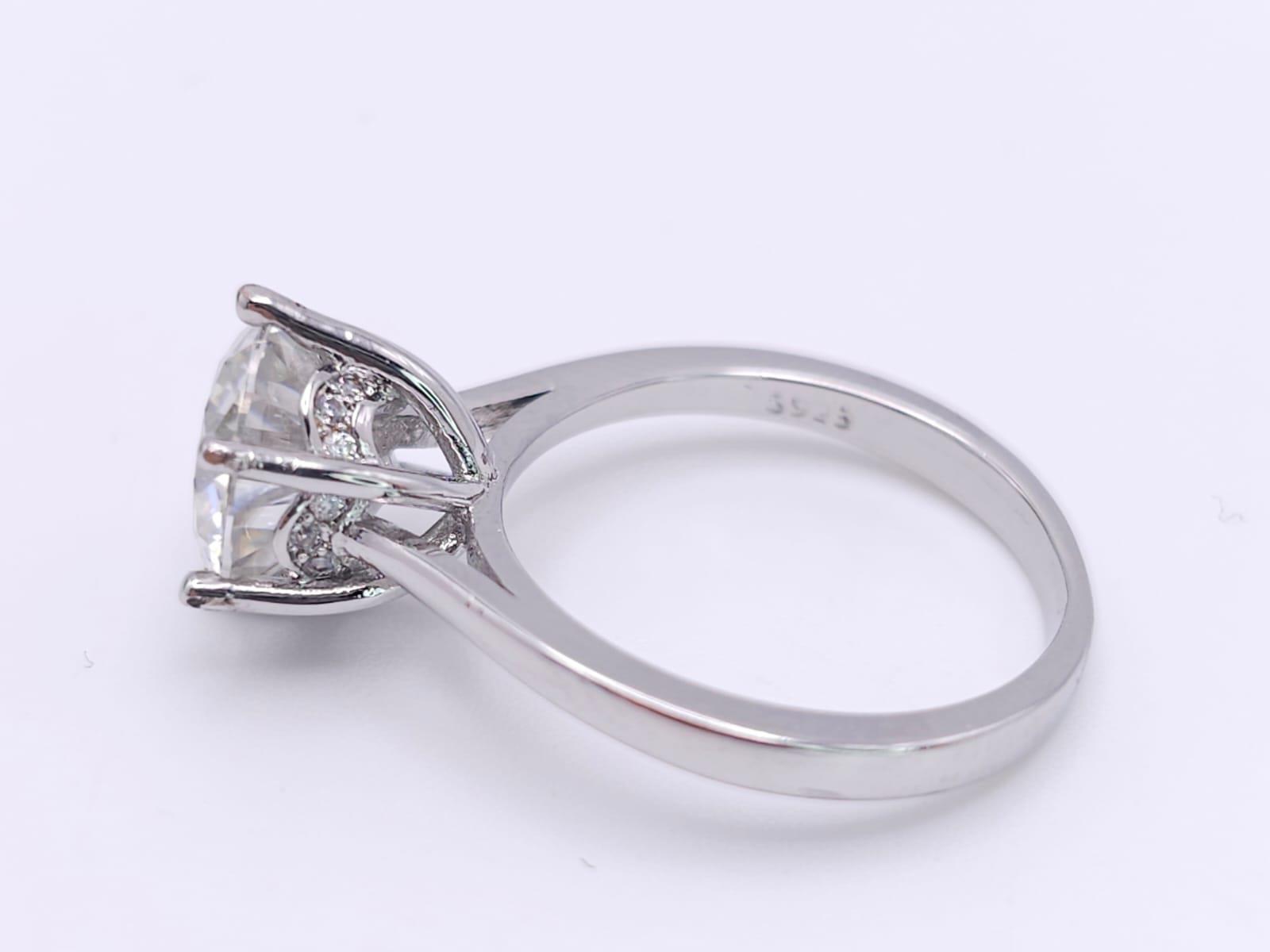 A sterling silver solitaire ring with a stunning round cut moissanite (3 carats), size: N, weight: - Image 5 of 13