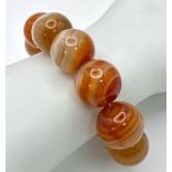 A Large Beaded Orange Banded Agate Bracelet. 15mm beads. 16cm.