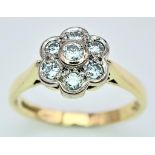 AN 18K YELLOW GOLD DIAMOND FLOWER CLUSTER RING. 0.25CTW. 3.8G. SIZE M.