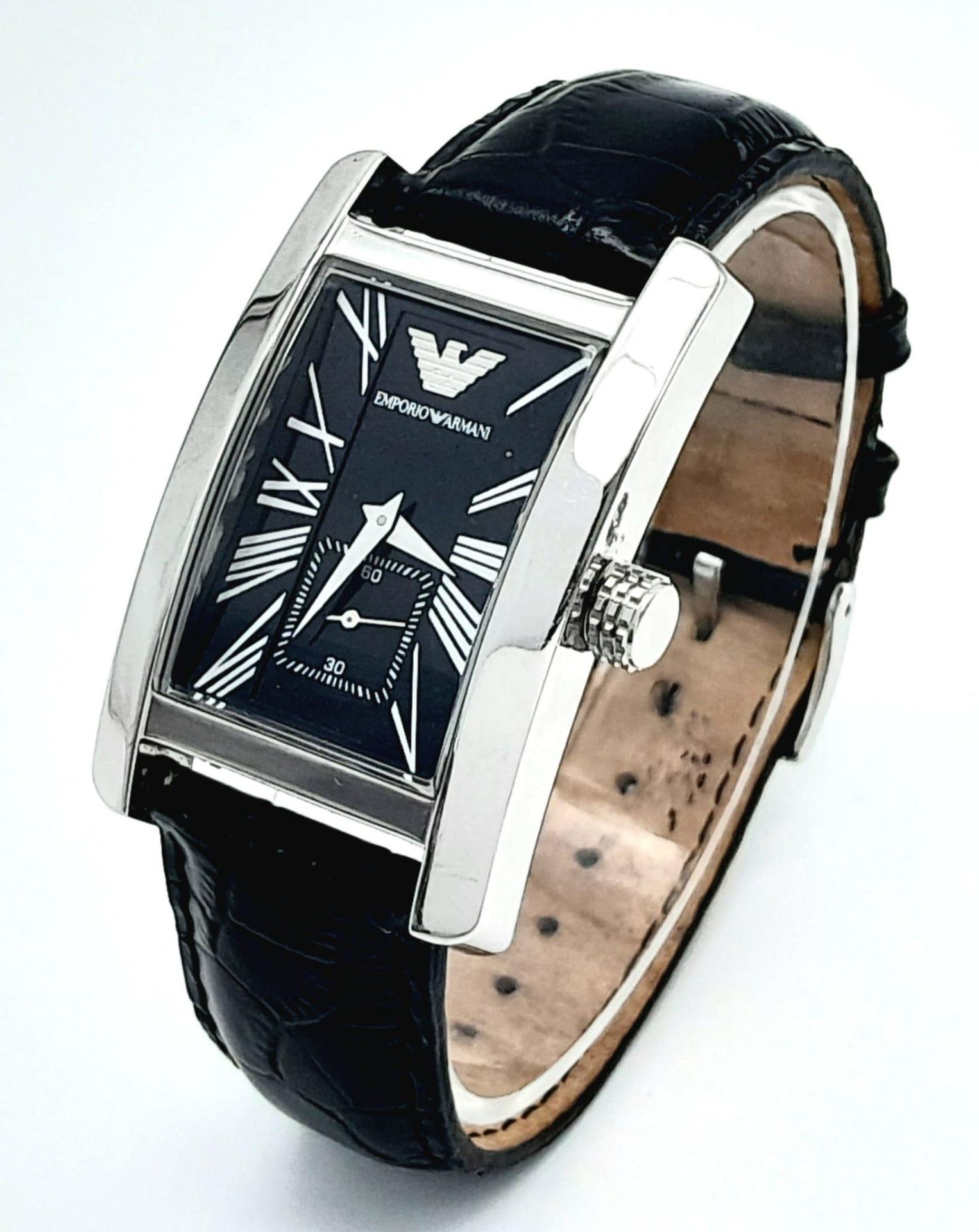 An Armani Designer Quartz Gents Watch. Black leather strap. Rectangular case - 31mm. Black dial with