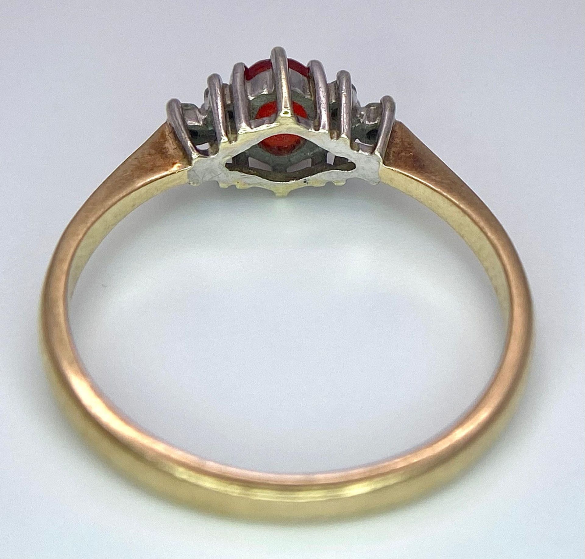 A Vintage 9K Yellow Gold, Red Sapphire and Diamond Ring. Oval sapphire with diamond accents. Size O. - Image 5 of 8