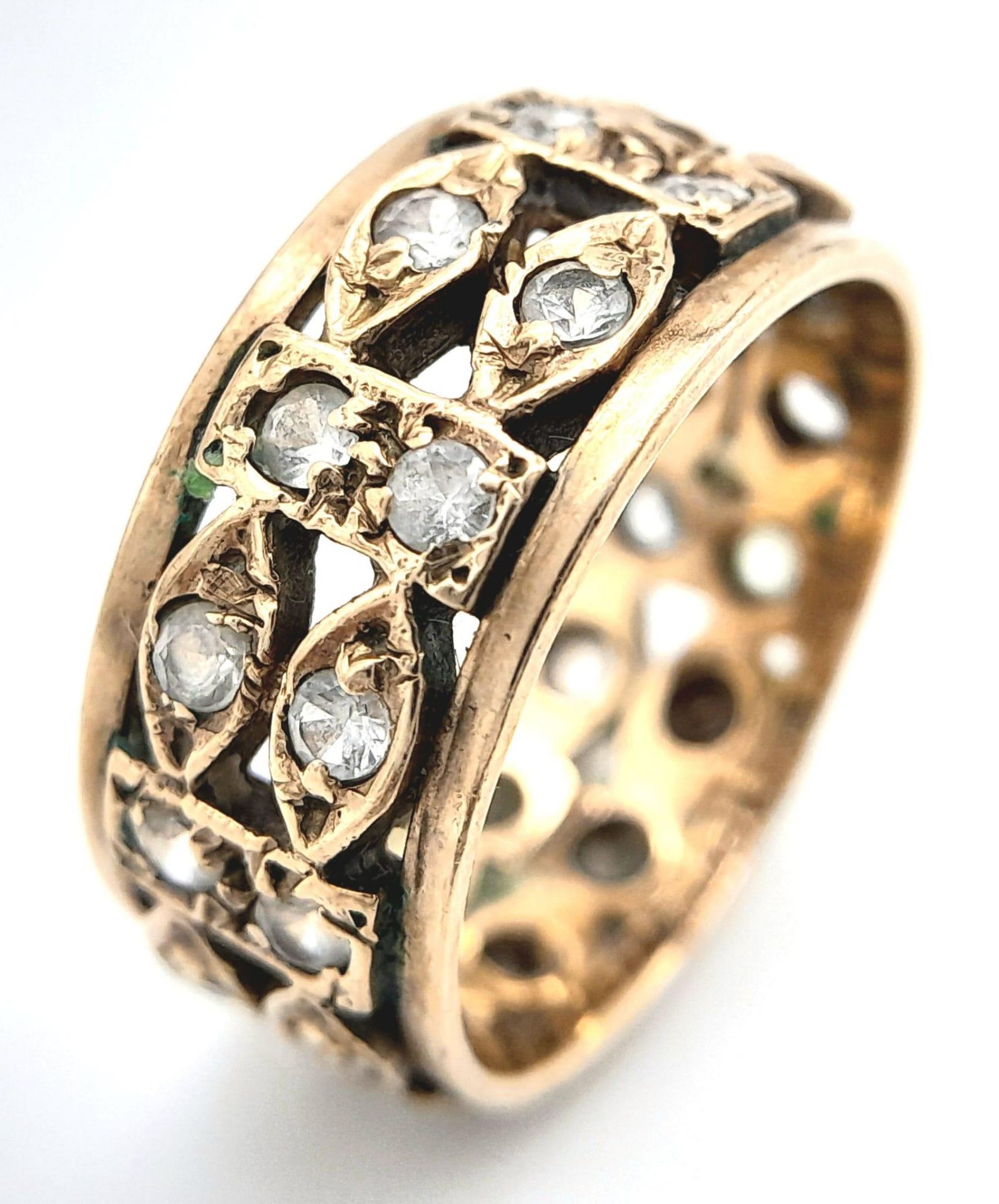 A Vintage 9K Diamond Band Ring. Two rows of old cut diamonds in oval and rectangular gold links.