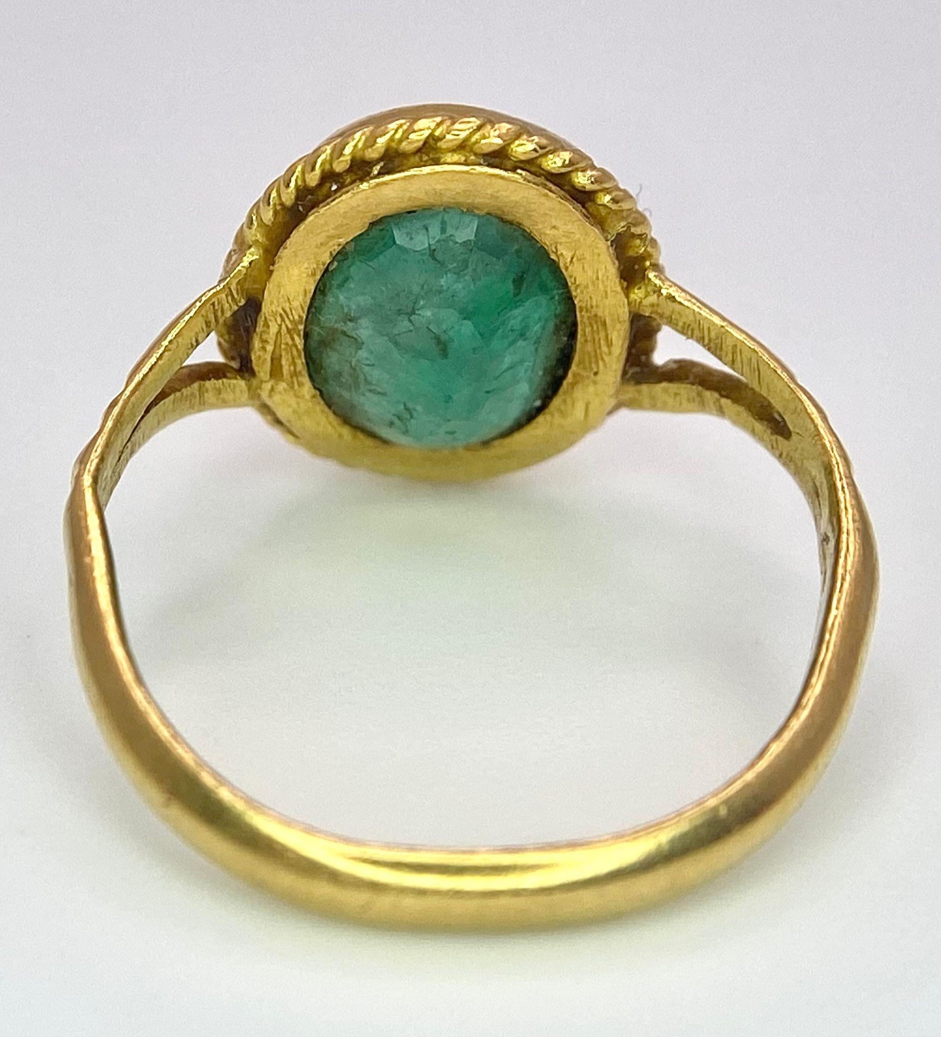 A 21K (tested) Green Emerald Ring. Central oval cut emerald. Size H. 3.15g weight. - Image 5 of 5