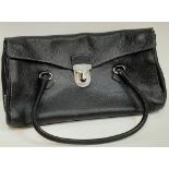A Prada Black Shoulder Bag. Leather exterior with silver-toned hardware, two rolled leather